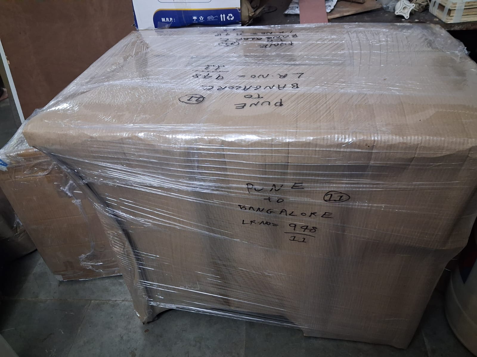Securely packed carton box labeled Pune to Bangalore by Aparajeet Packers and Movers