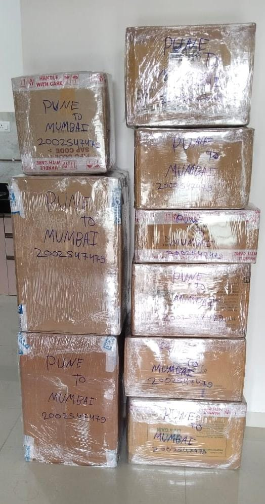 Stacked carton boxes packed for Pune to Mumbai relocation by Aparajeet Packers